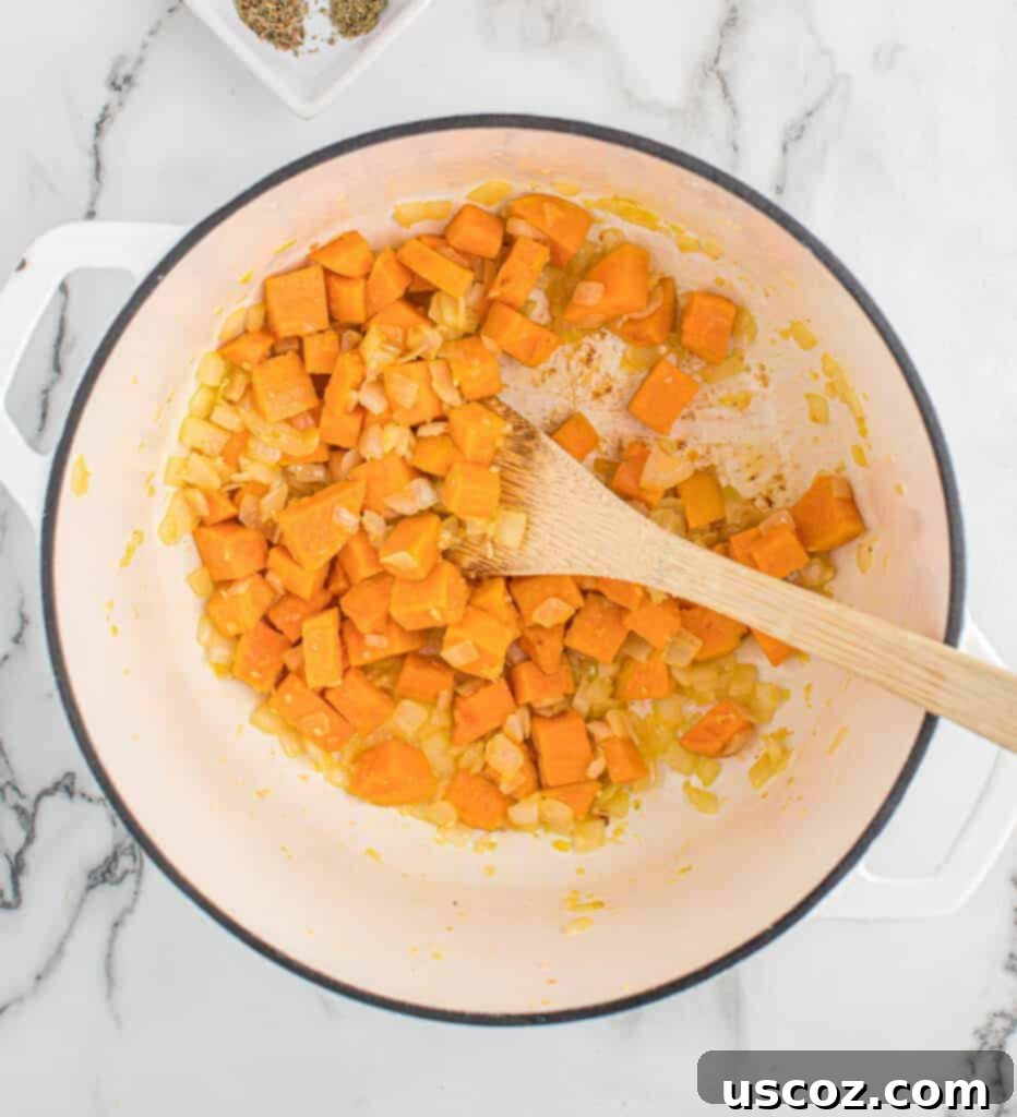 Golden Sweet Potato Strands 4 stirring the garlic, onion, and sweet potatoes in a dutch oven