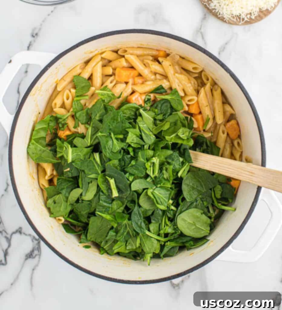 Golden Sweet Potato Strands 9 adding fresh spinach to the sweet potato pasta