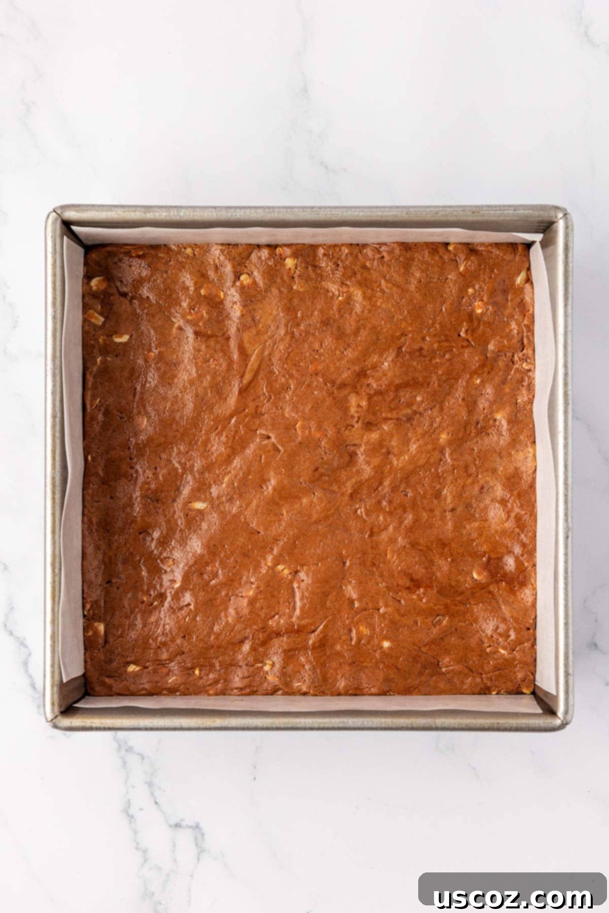 Protein-Packed Chocolate Bars 7 Chocolate protein bar mixture pressed firmly into an 8x8 inch baking dish lined with parchment paper