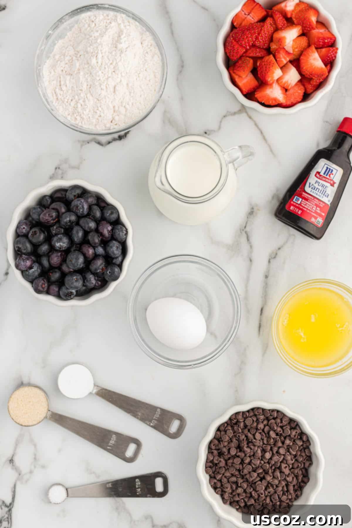 Breakfast Pancake Bites 4 All the necessary ingredients laid out for making mini pancake muffins, including flour, milk, eggs, butter, sugar, baking powder, and salt.