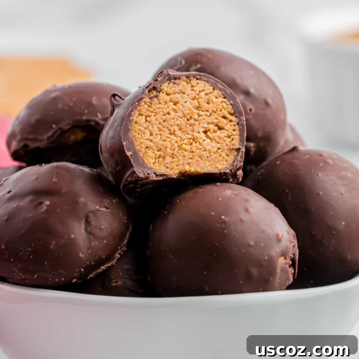 No-Bake Peanut Butter Graham Bites 2 Peanut Butter Balls with Graham Crackers arranged beautifully on a plate, ready to be served.