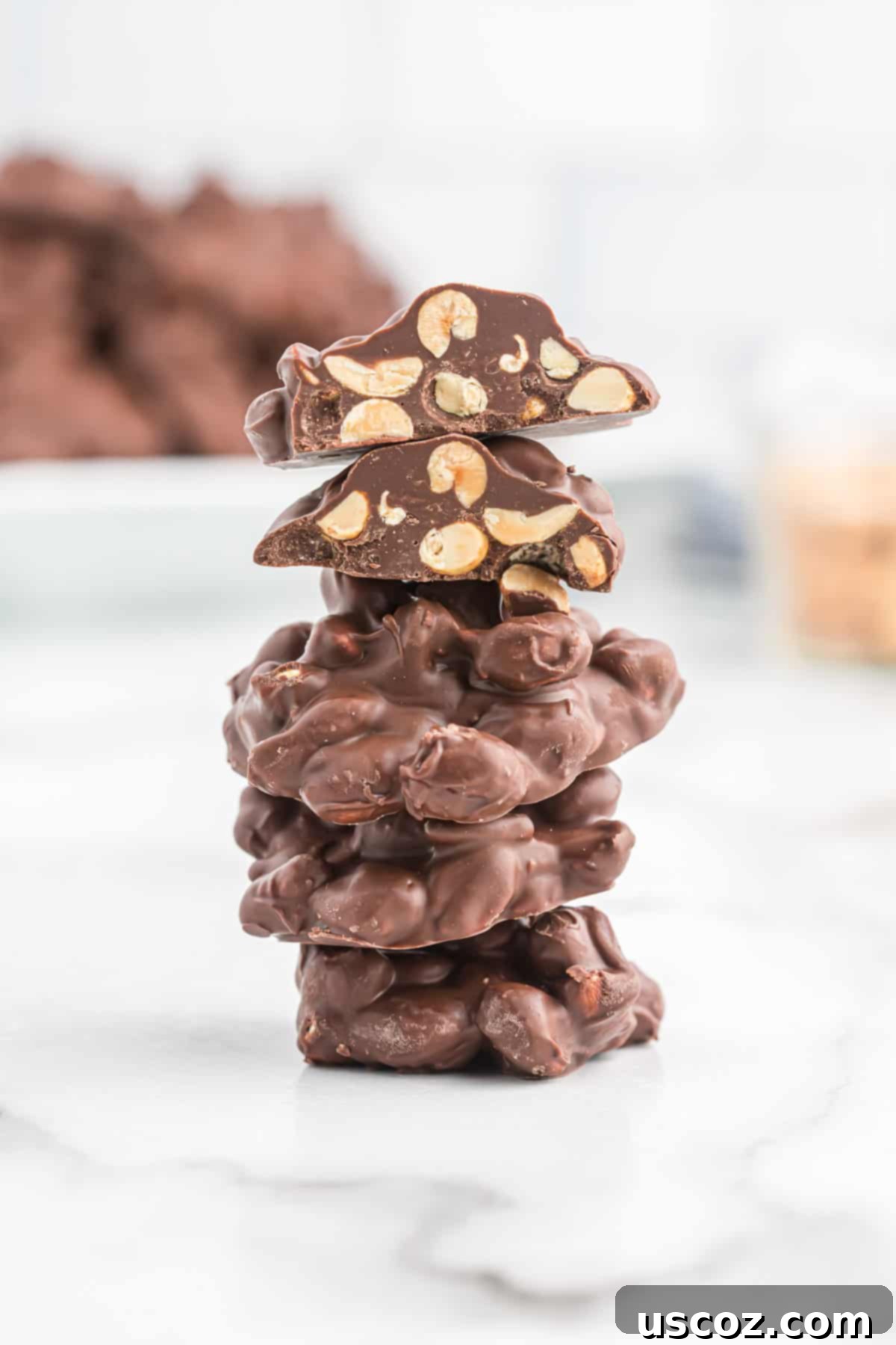Slow Cooker Chocolate Peanut Clusters 13 peanut clusters stacked beautifully