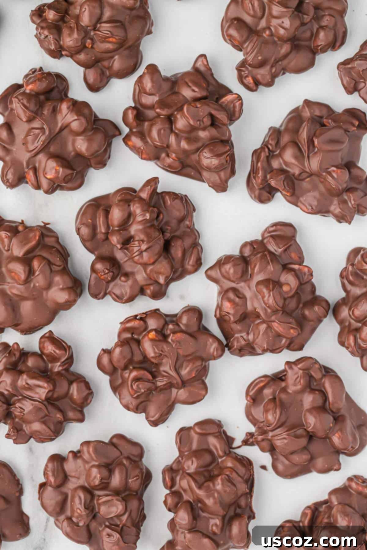 Slow Cooker Chocolate Peanut Clusters 3 crock pot peanut clusters arranged on a plate