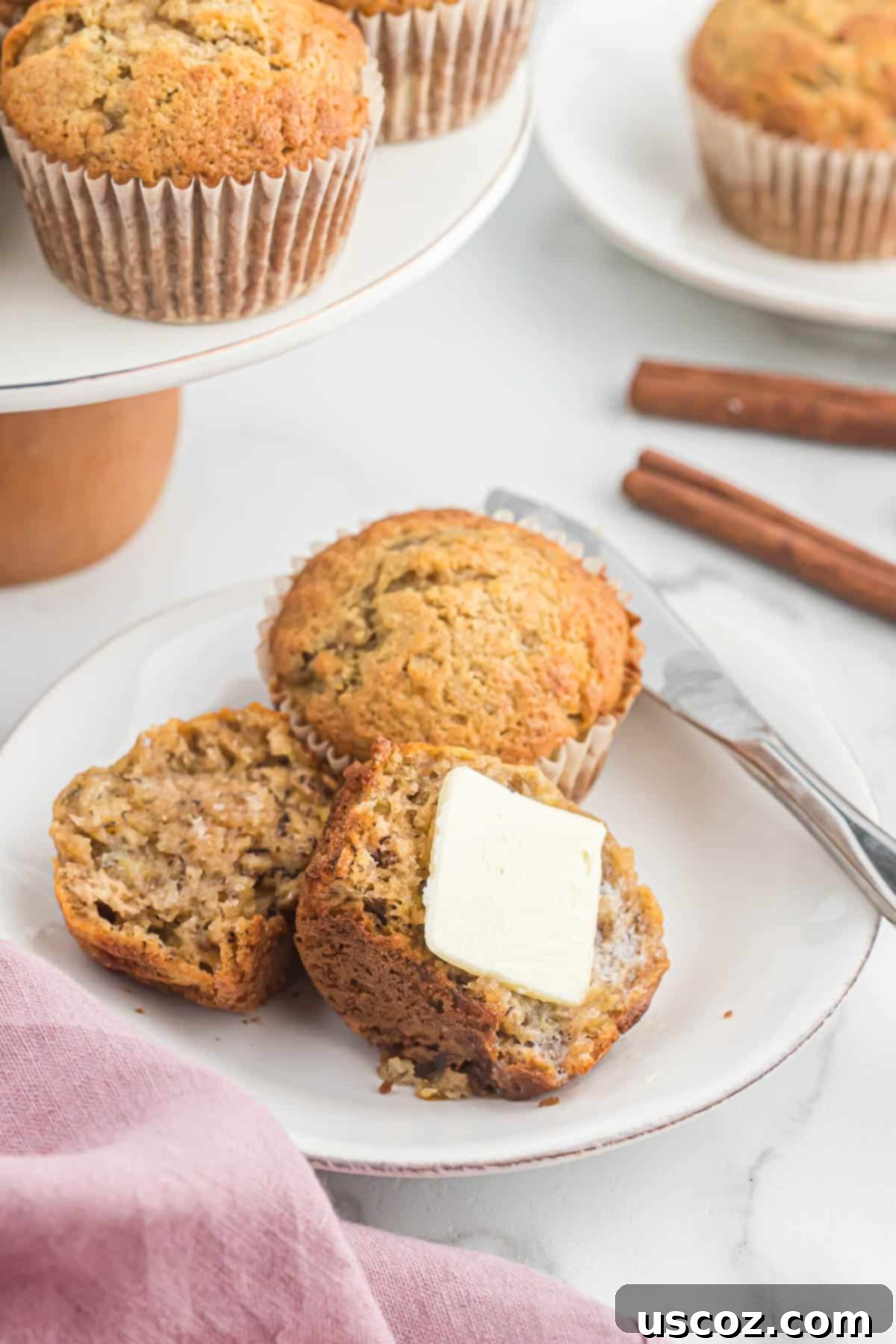 Foolproof Banana Bread Muffins 14 banana bread muffin cut in half with butter melting on it