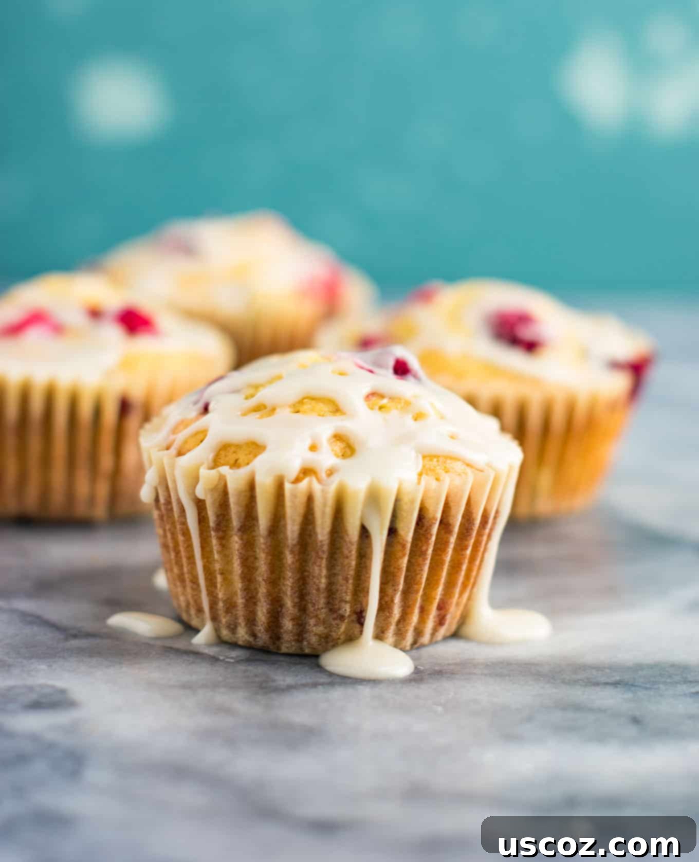 Luscious Cranberry Cream Cheese Muffins 10 A basket overflowing with freshly baked cranberry cream cheese muffins, indicating a bountiful and delicious yield.