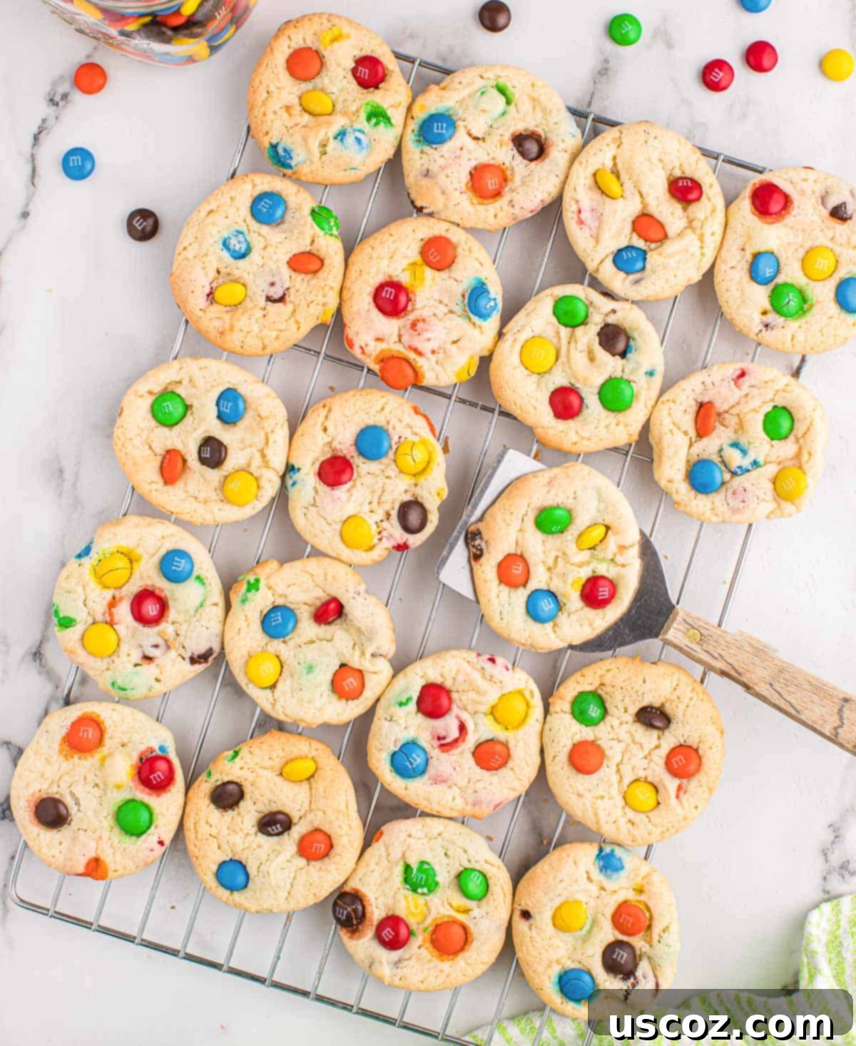 Fluffy White Cake Mix Cookies 3 Freshly baked white cake mix cookies cooling on a wire rack, ready to be enjoyed.