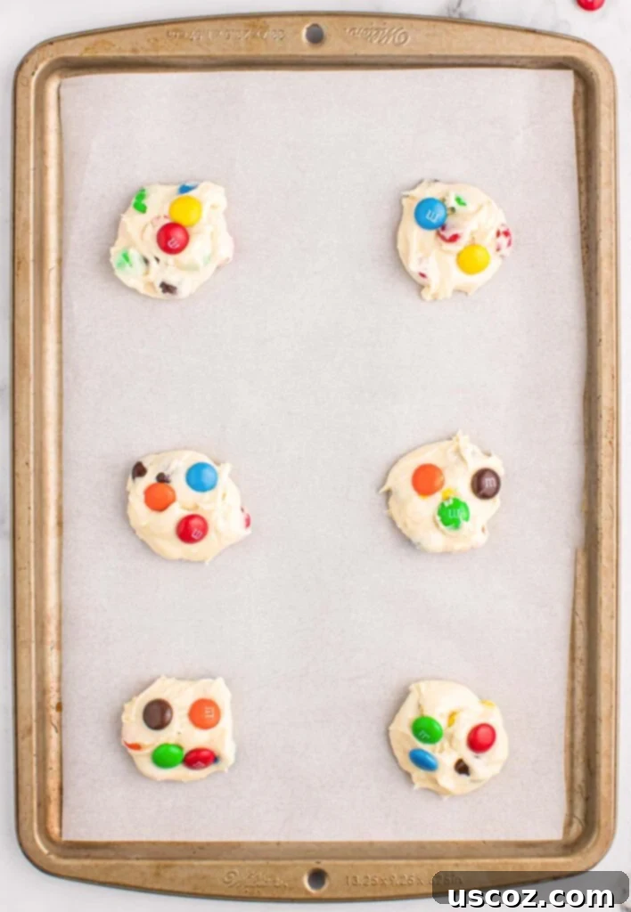 Fluffy White Cake Mix Cookies 8 Cake mix cookie batter carefully placed on a lined baking sheet, ready for the oven.