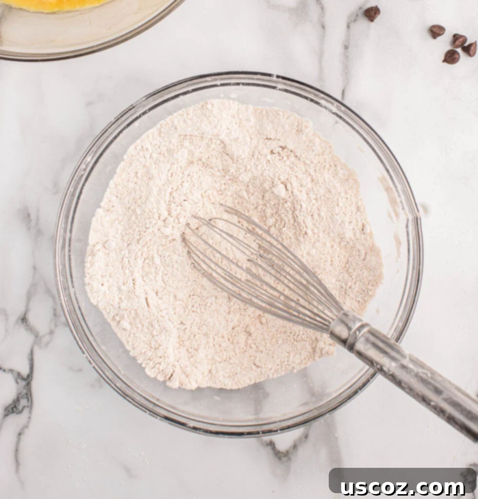 The Ultimate Chocolate Chip Banana Bread 5 Mixing together dry ingredients for banana bread