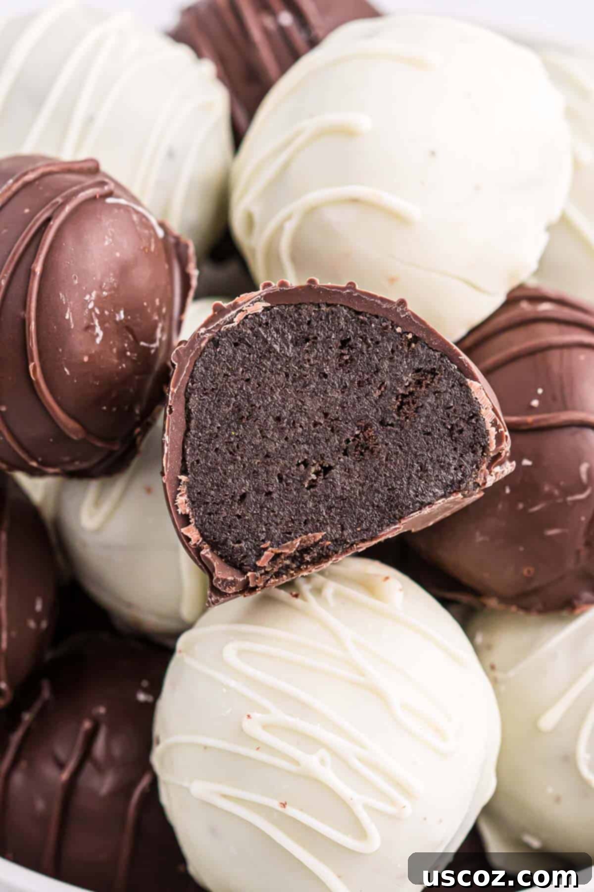 Minty Oreo Truffle Bites 2 oreo ball cut in half to show the creamy mint filling