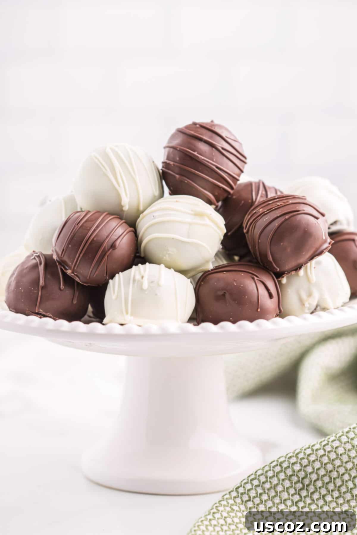 Minty Oreo Truffle Bites 12 oreo balls on a dessert platter ready to serve