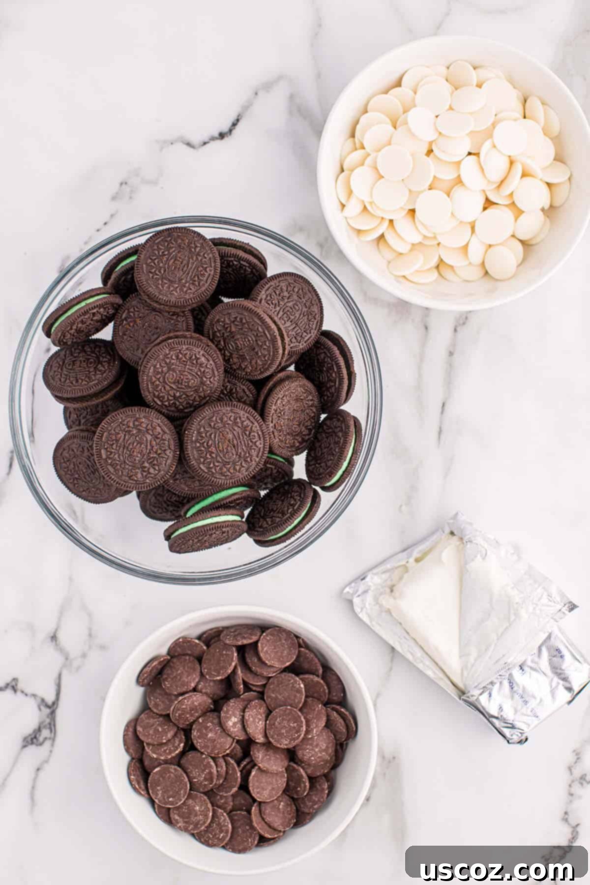 Minty Oreo Truffle Bites 3 ingredients needed to make mint oreo balls laid out on a table
