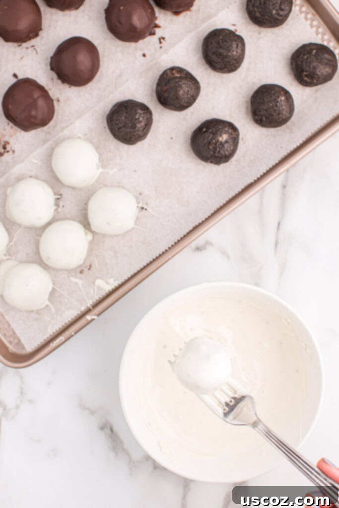 Minty Oreo Truffle Bites 9 dipping an oreo ball into melted white chocolate