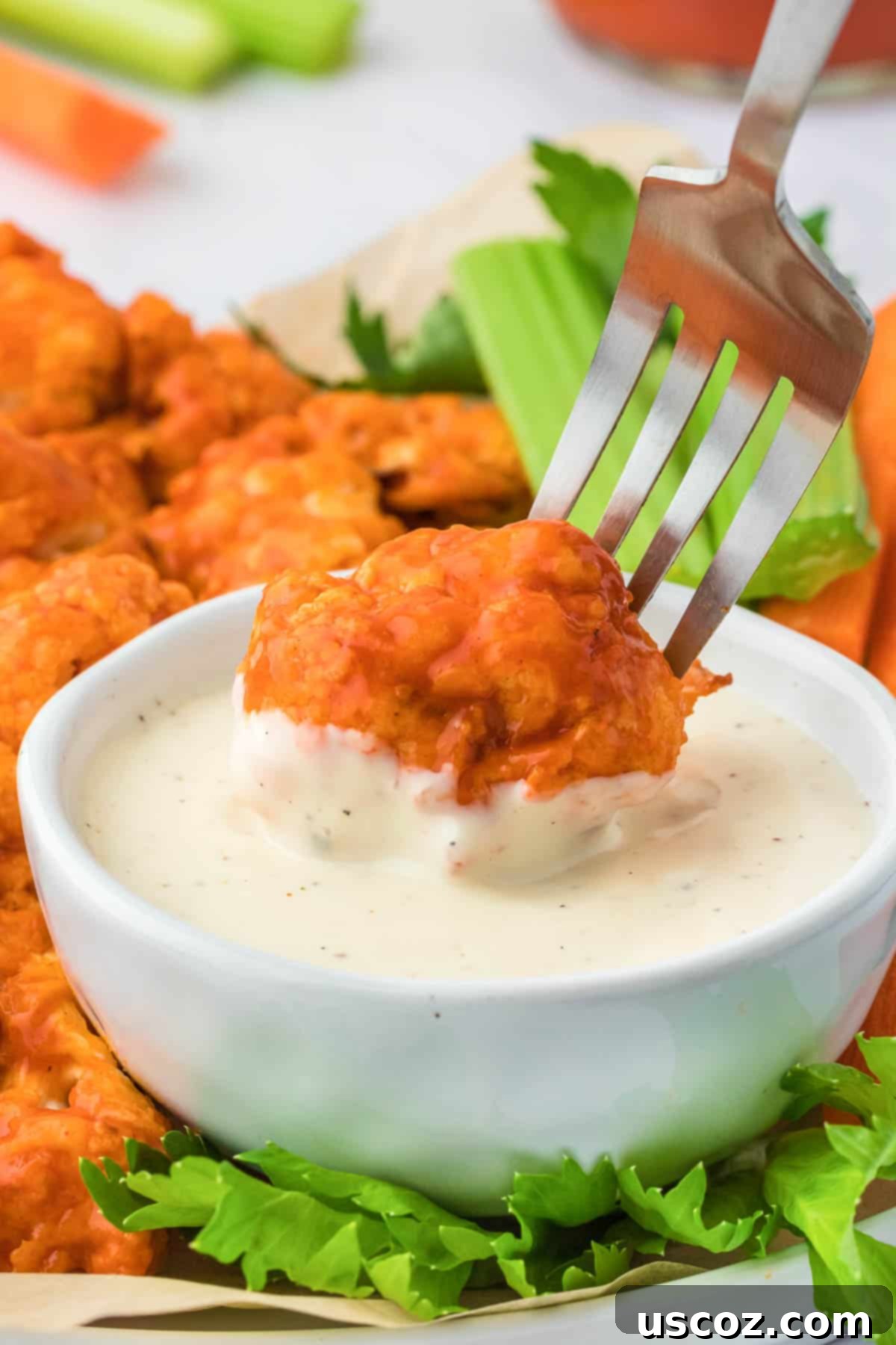 Air Fryer Buffalo Cauliflower Wings 13 dipping buffalo cauliflower into ranch