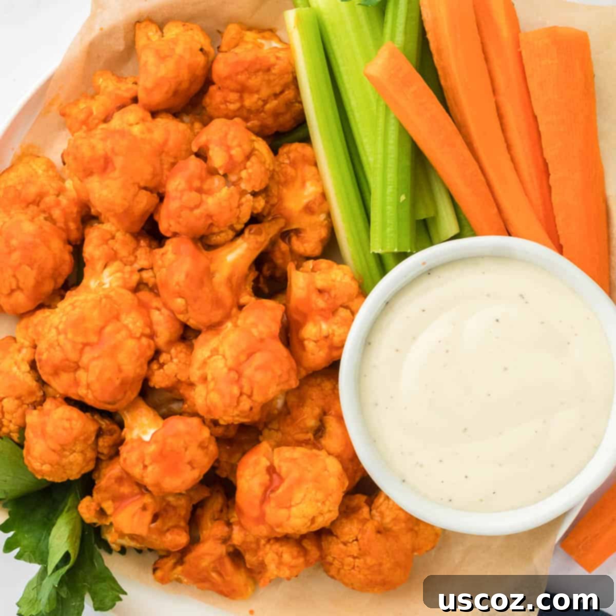 Air Fryer Buffalo Cauliflower Wings 15 buffalo cauliflower bites with celery, carrots, and ranch