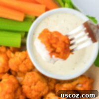 Air Fryer Buffalo Cauliflower Wings 16 dipping buffalo cauliflower into ranch
