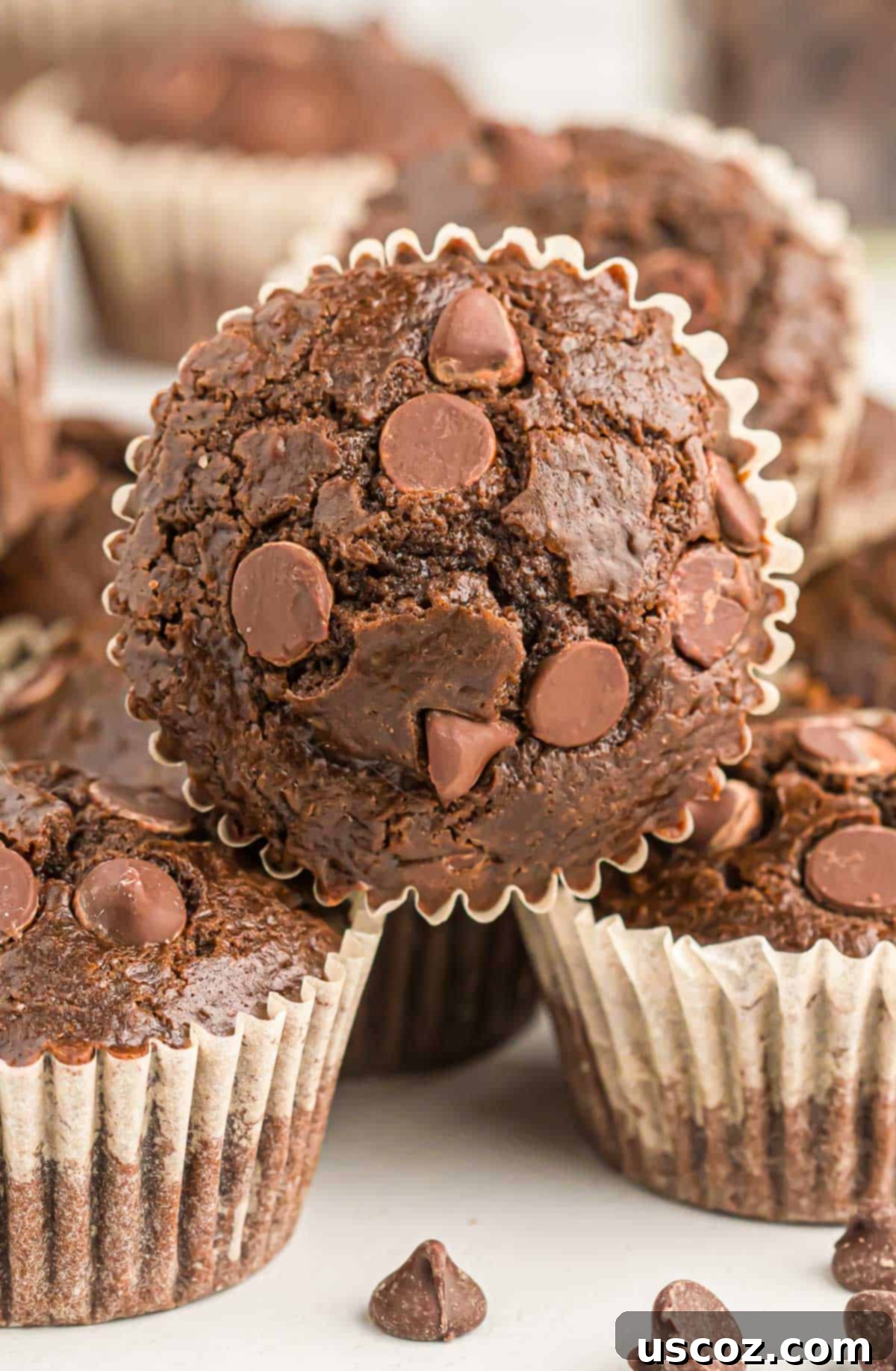 Ultimate Double Chocolate Muffins 3 stack of moist double chocolate muffins, showcasing their rich texture