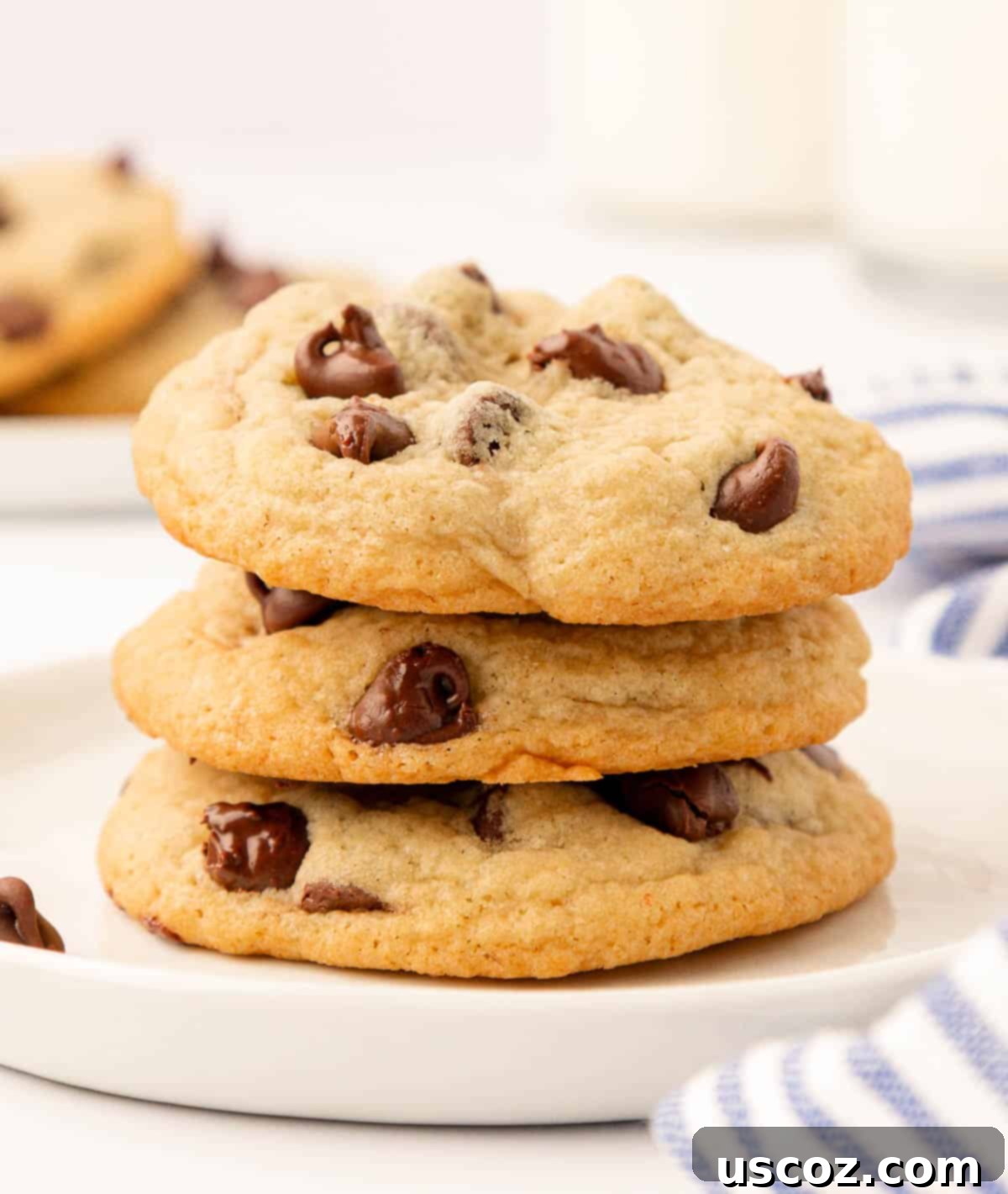 Golden Crisp Chocolate Chip Cookies 19 three chocolate chip cookies stacked showing soft interior
