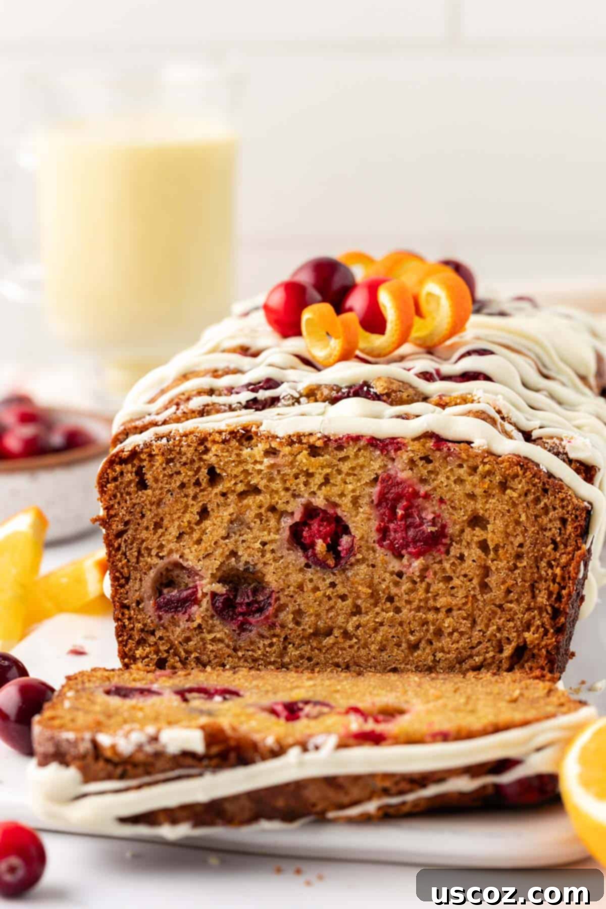 Festive Cranberry Eggnog Bread 2 cranberry eggnog bread with white chocolate glaze and fresh cranberries
