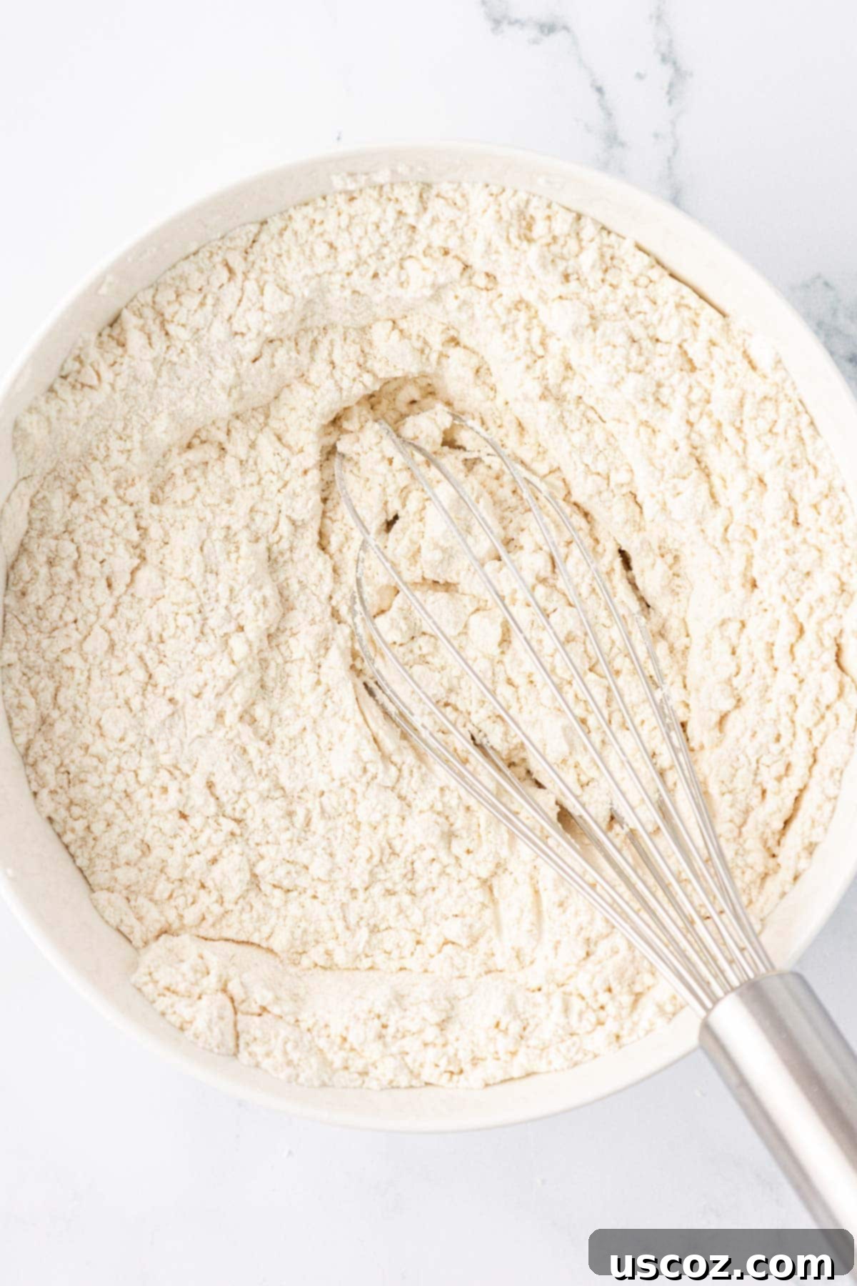 Festive Cranberry Eggnog Bread 8 dry ingredients mixed together in a bowl
