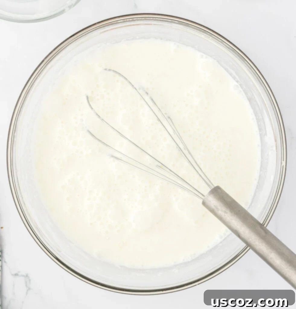 Hearty Potato Comfort 13 Milk, heavy cream, and flour expertly mixed together into a smooth, lump-free slurry, prepared to thicken the potato soup.