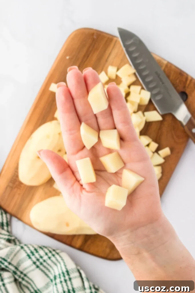 Hearty Potato Comfort 8 Small, uniformly diced and peeled russet potatoes, ready to be added to the soup.