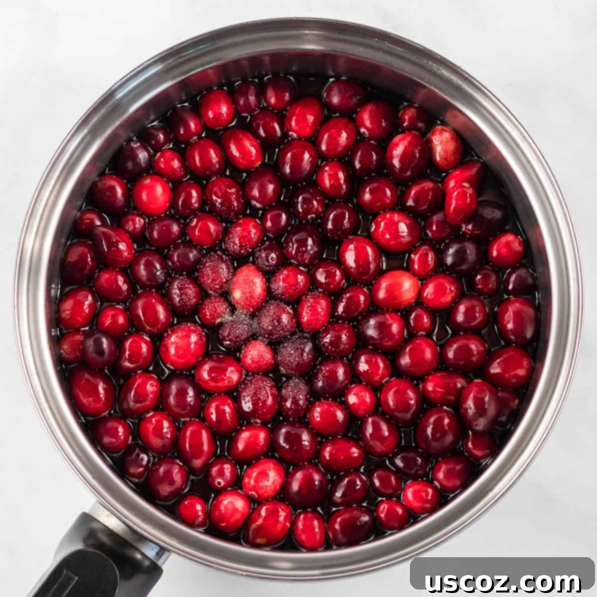 Perfect Homemade Cranberry Sauce 4 All three cranberry sauce ingredients in a saucepan, ready for cooking