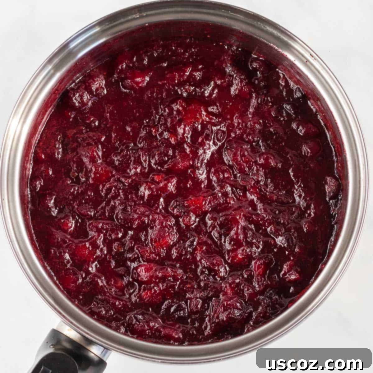 Perfect Homemade Cranberry Sauce 6 Cranberry sauce simmering in a saucepan after the cranberries have burst