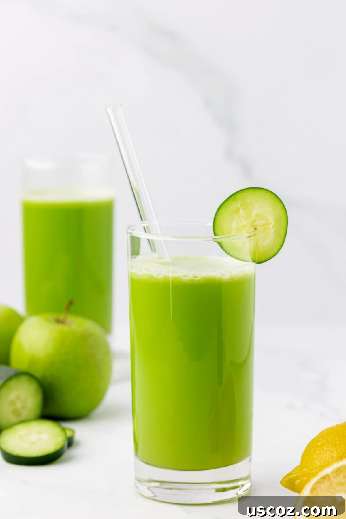 Cool Cucumber Elixir 2 juice in a glass with a cucumber slice on the rim