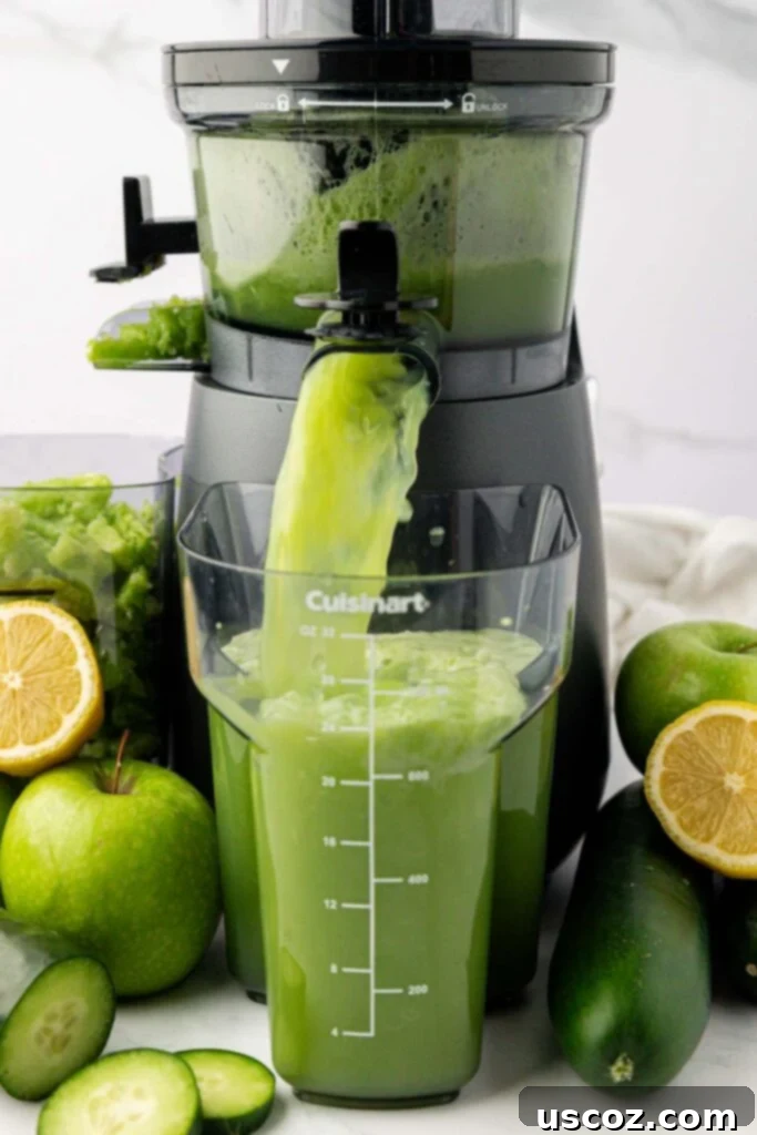 Cool Cucumber Elixir 5 cucumber juice coming out of a juicer