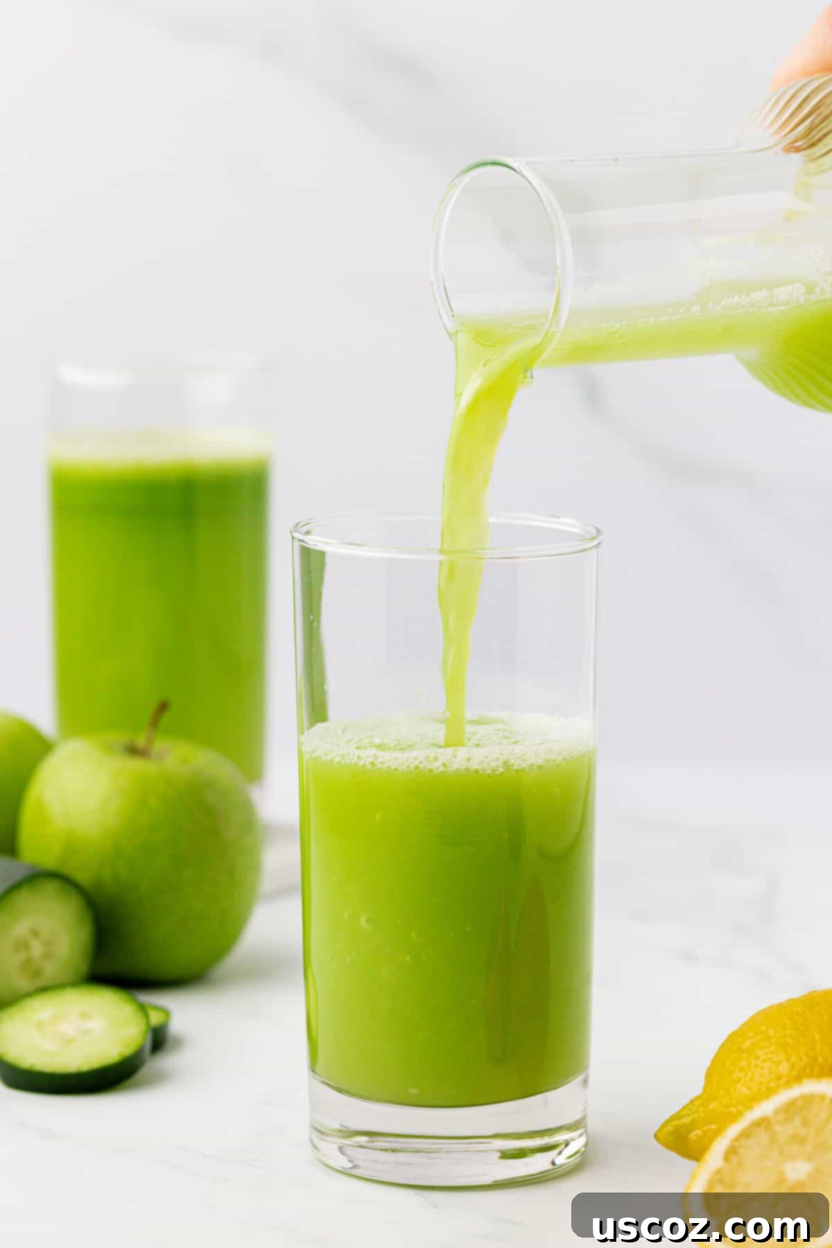 Cool Cucumber Elixir 7 pouring cucumber juice into a glass