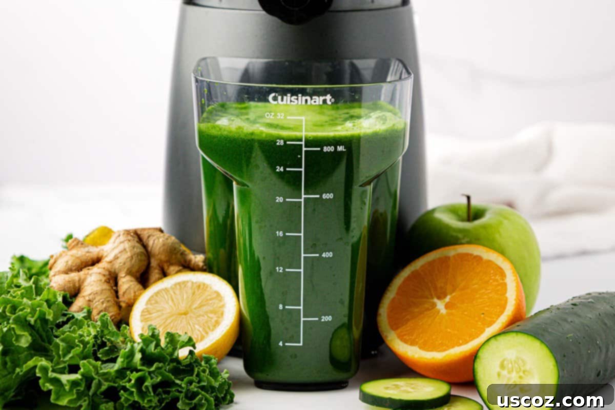 Emerald Elixir 3 Fresh kale juice being collected in a juicing canister, showcasing the vibrant green color.