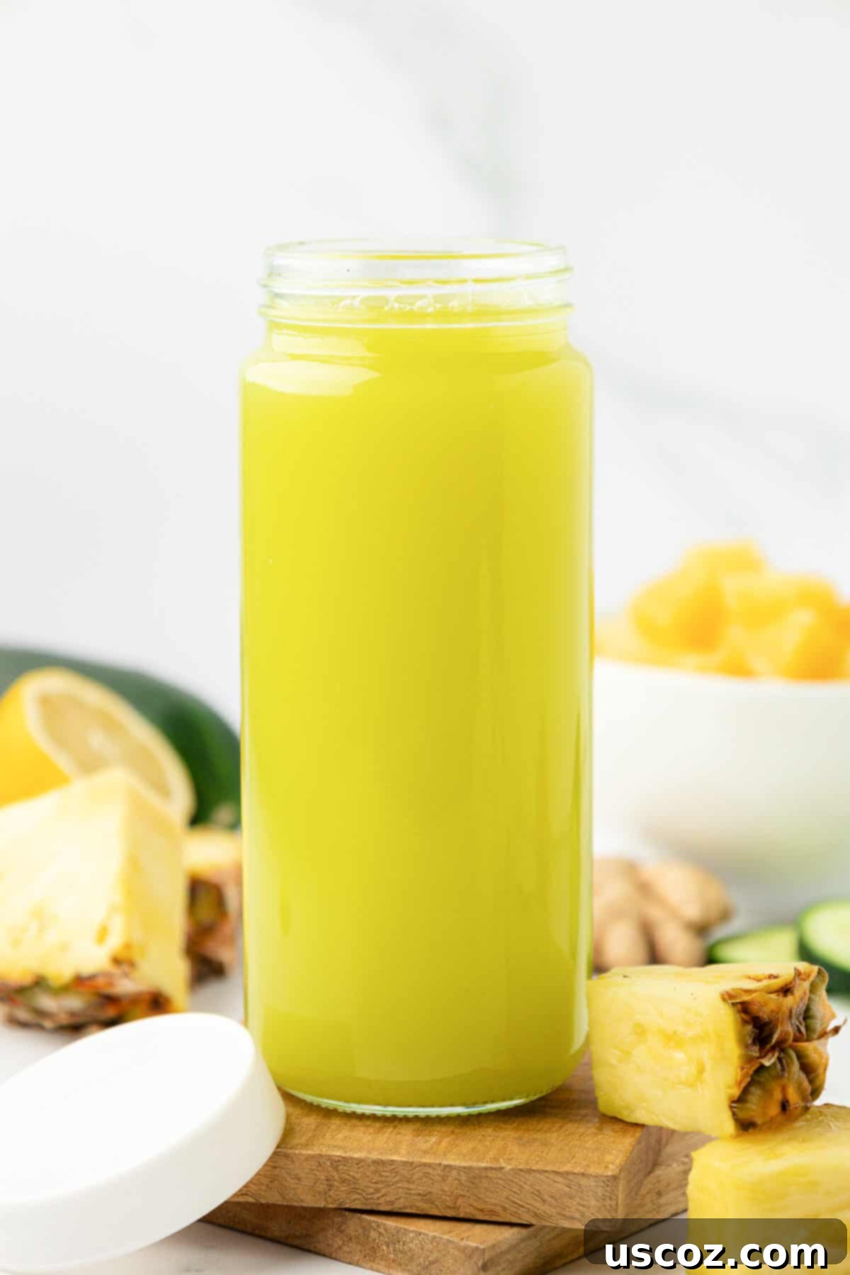 Hydrating Pineapple Cucumber Quencher 11 pineapple cucumber juice in a glass with a lid for storage