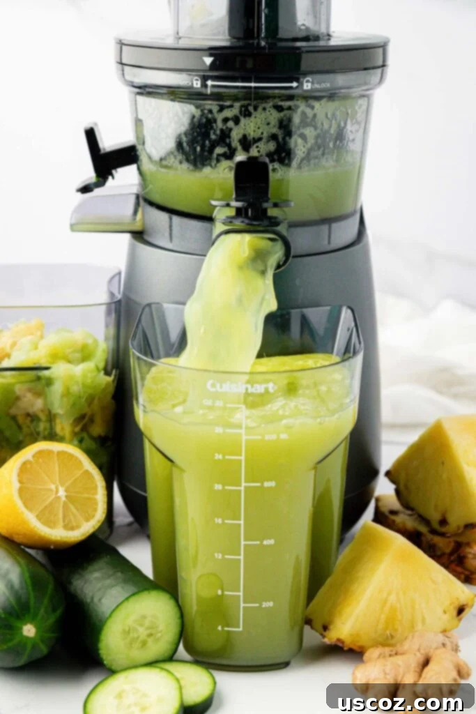 Hydrating Pineapple Cucumber Quencher 5 pineapple cucumber juice coming out of a juicer