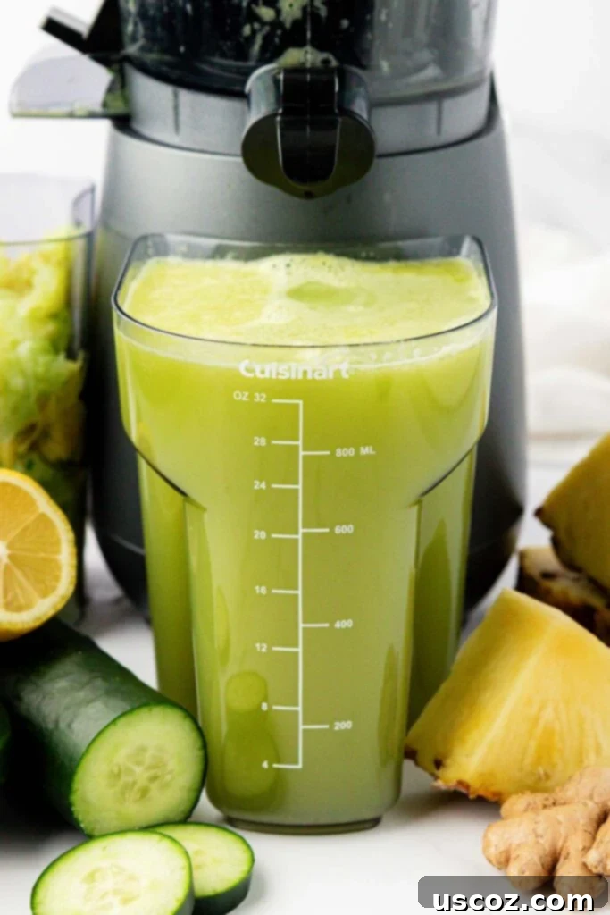 Hydrating Pineapple Cucumber Quencher 6 pineapple cucumber juice in a juicing canister