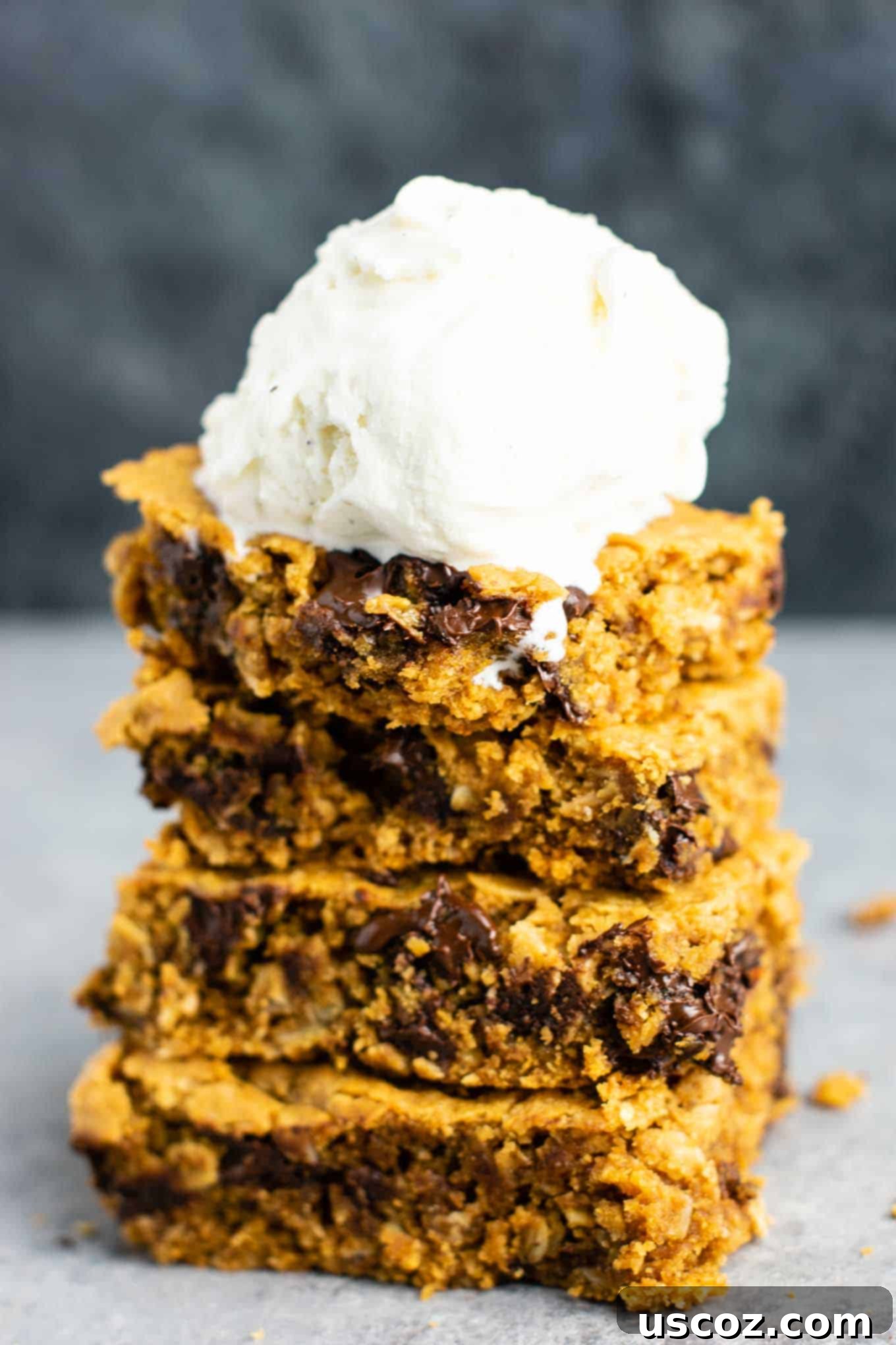 The Best Gluten-Free Cookie Bars 8 A close-up view of a single Gluten-Free Peanut Butter Chocolate Chip Cookie Bar, showcasing its soft interior and melted chocolate. This delightful dairy-free and healthy dessert is perfect for any time. #glutenfree #cookiebars #dessert #dairyfree #healthydessert #glutenfreedessert #glutenfreerecipe #glutenfreecookiebars
