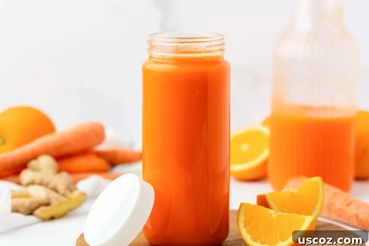 Vibrant Carrot Elixir 11 carrot juice in a glass with a lid