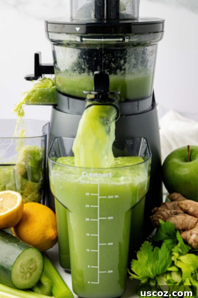Celery Juice 5 Celery juice actively coming out of a juicer