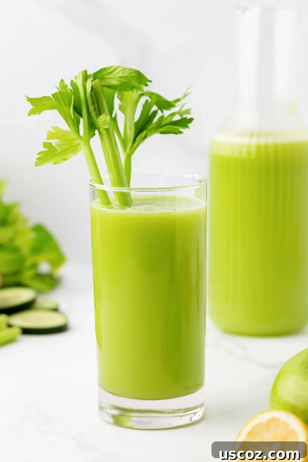 Celery Juice 8 Celery juice in a glass, with a piece of celery inside for garnish