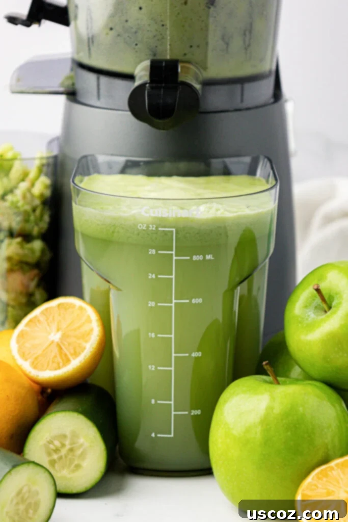 Emerald Zest Drink 6 Collection canister filled with freshly squeezed green apple juice.