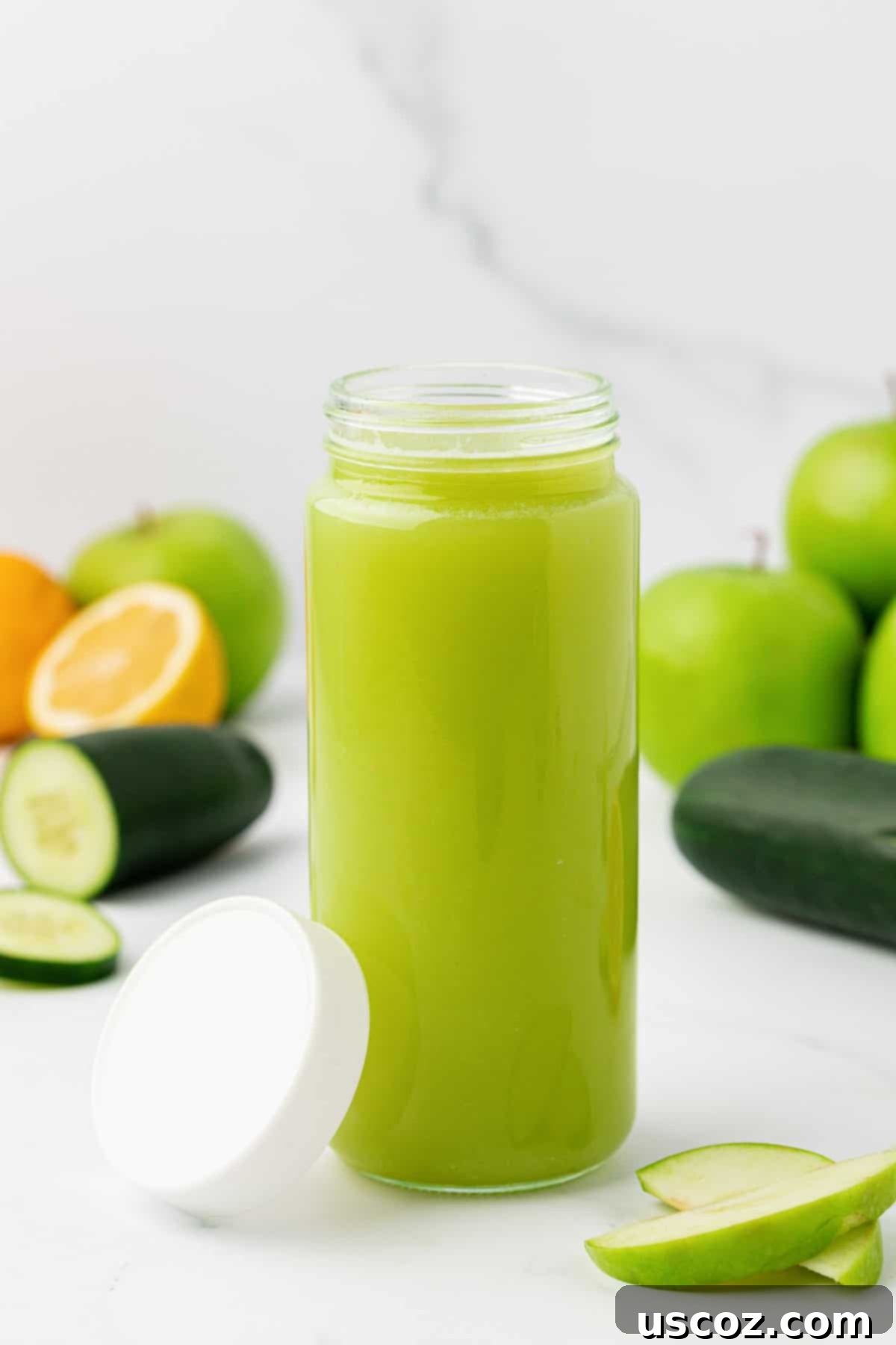 Emerald Zest Drink 9 Fresh green apple juice stored in a clear glass jar with a lid.