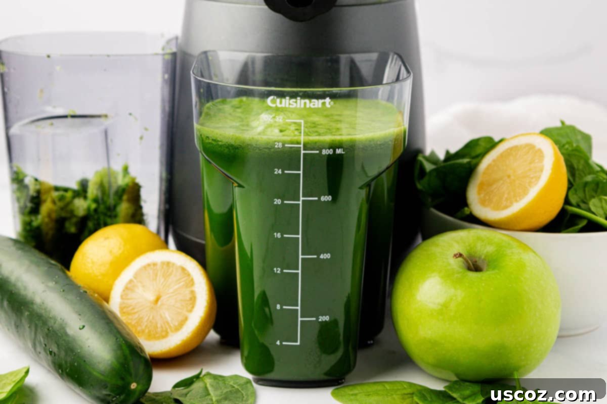 Vibrant Green Elixir 3 Fresh spinach juice being collected in the juicer's container