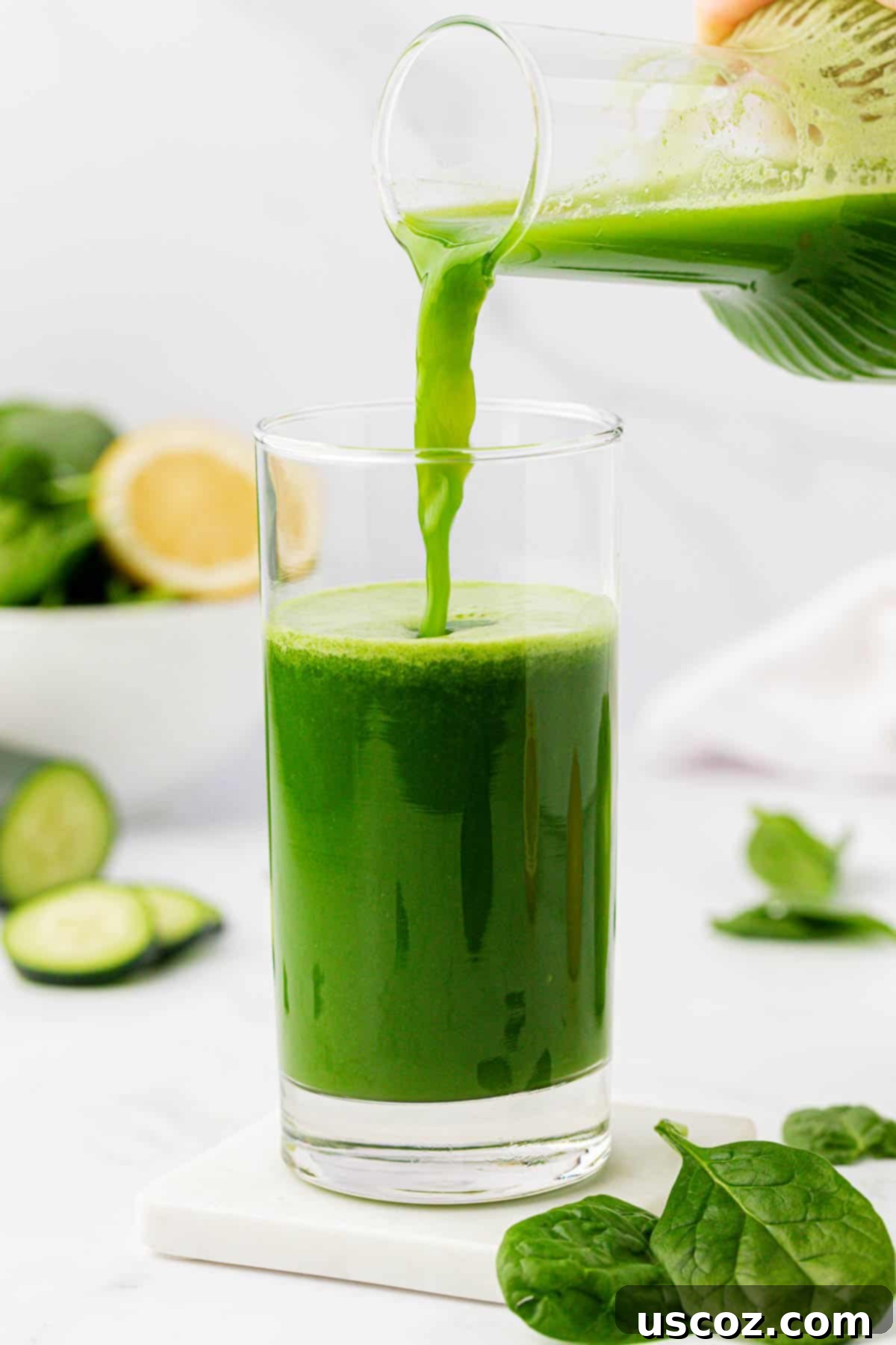 Vibrant Green Elixir 7 Pouring fresh green spinach juice from a container into a drinking glass