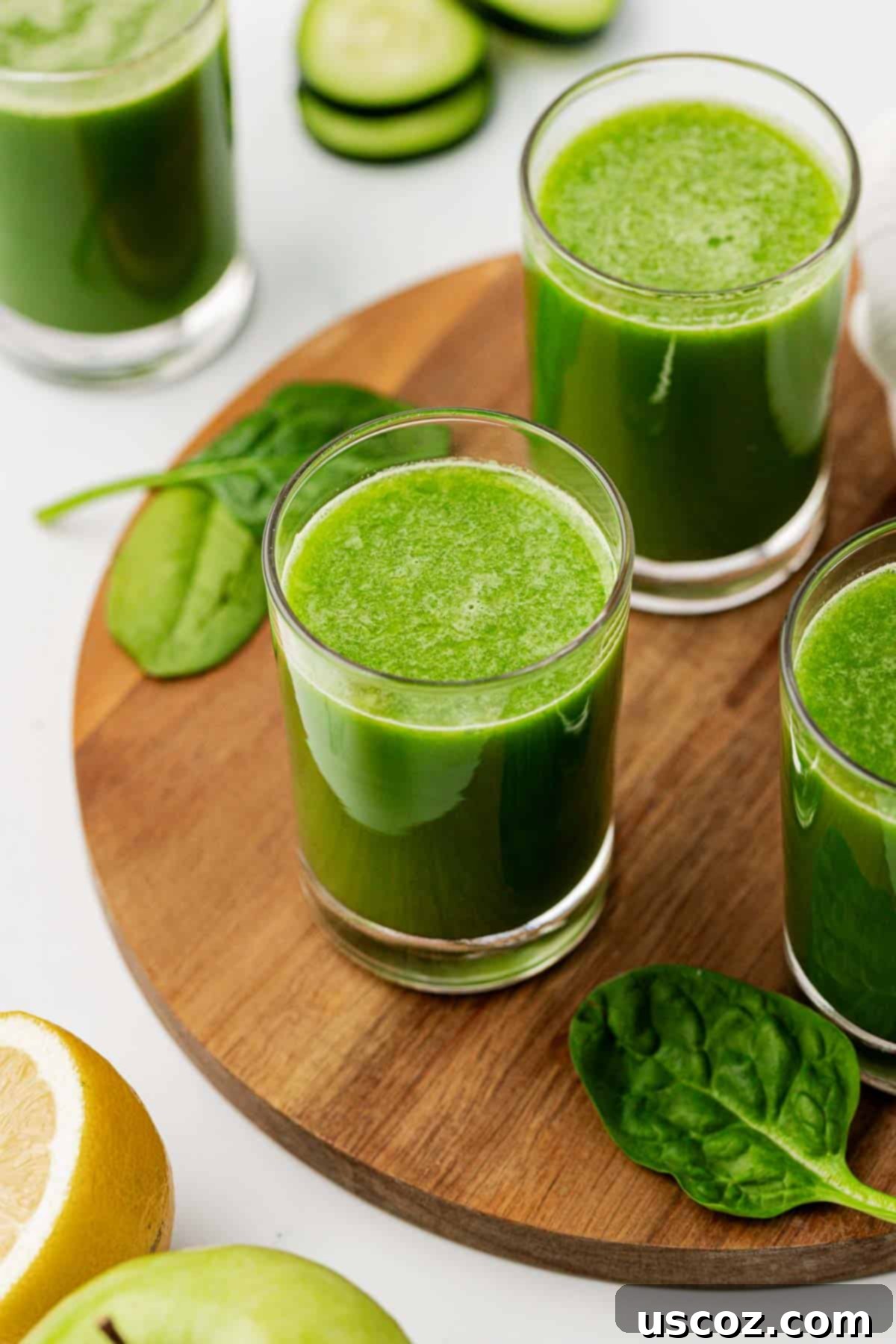 Vibrant Green Elixir 8 A glass of spinach juice resting on a rustic wooden cutting board