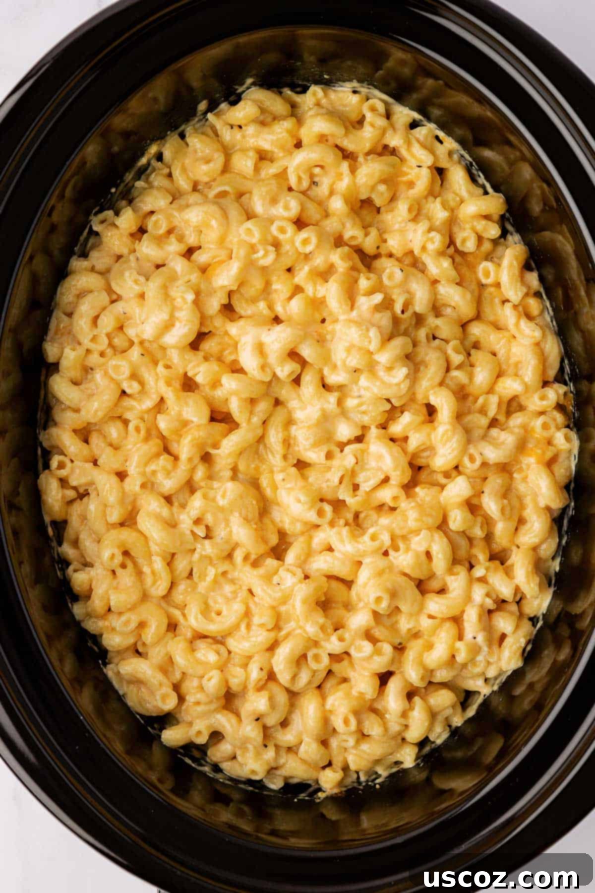 Creamy Slow Cooker Mac and Cheese 8 A close-up of the creamy, uncooked mac and cheese mixture ready for slow cooking in a crock pot