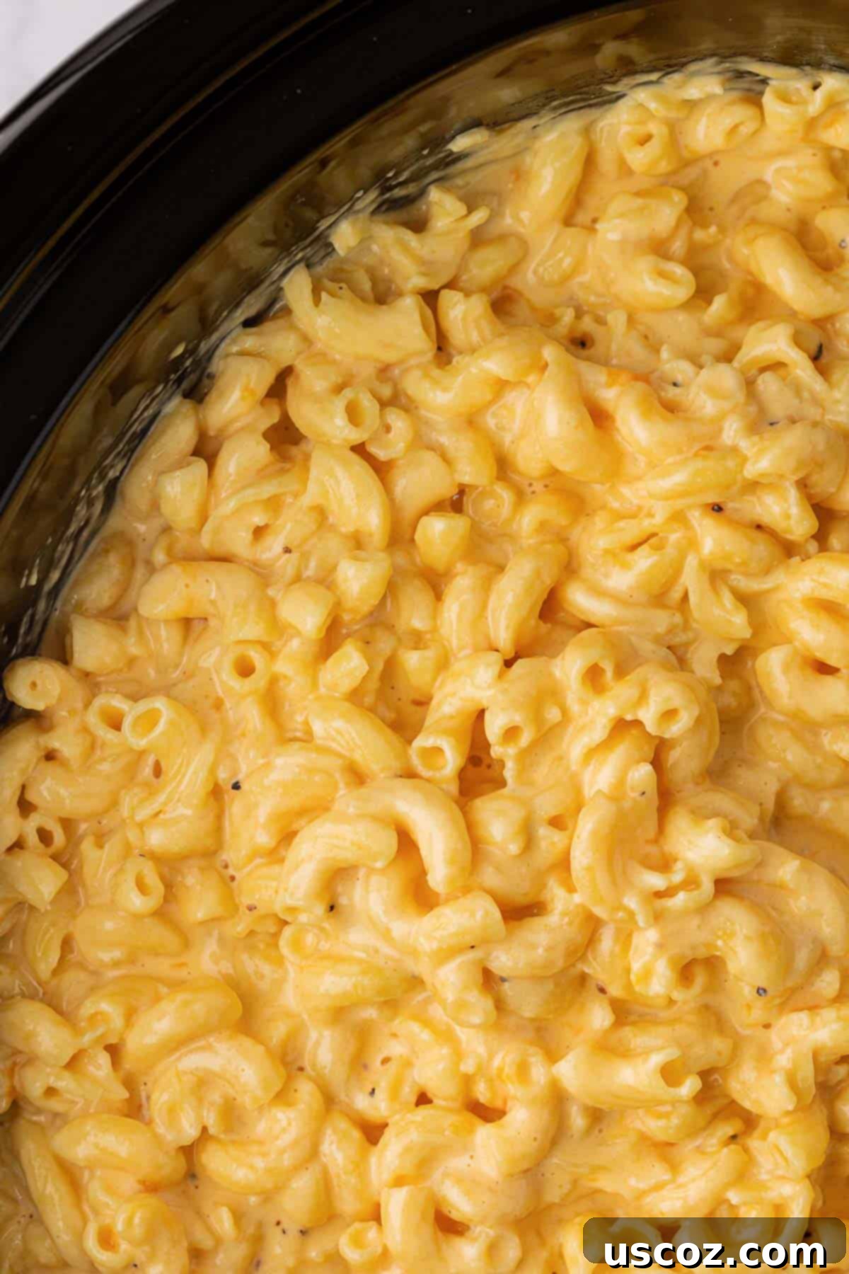 Creamy Slow Cooker Mac and Cheese 9 Uncovered macaroni and cheese mixture, perfectly smooth and ready for slow cooking in a crock pot