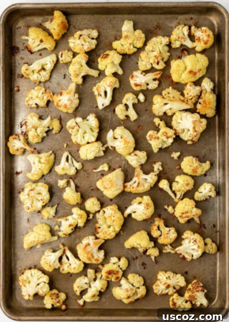 Golden Cheesy Roasted Cauliflower 14 roasted cauliflower on a baking sheet