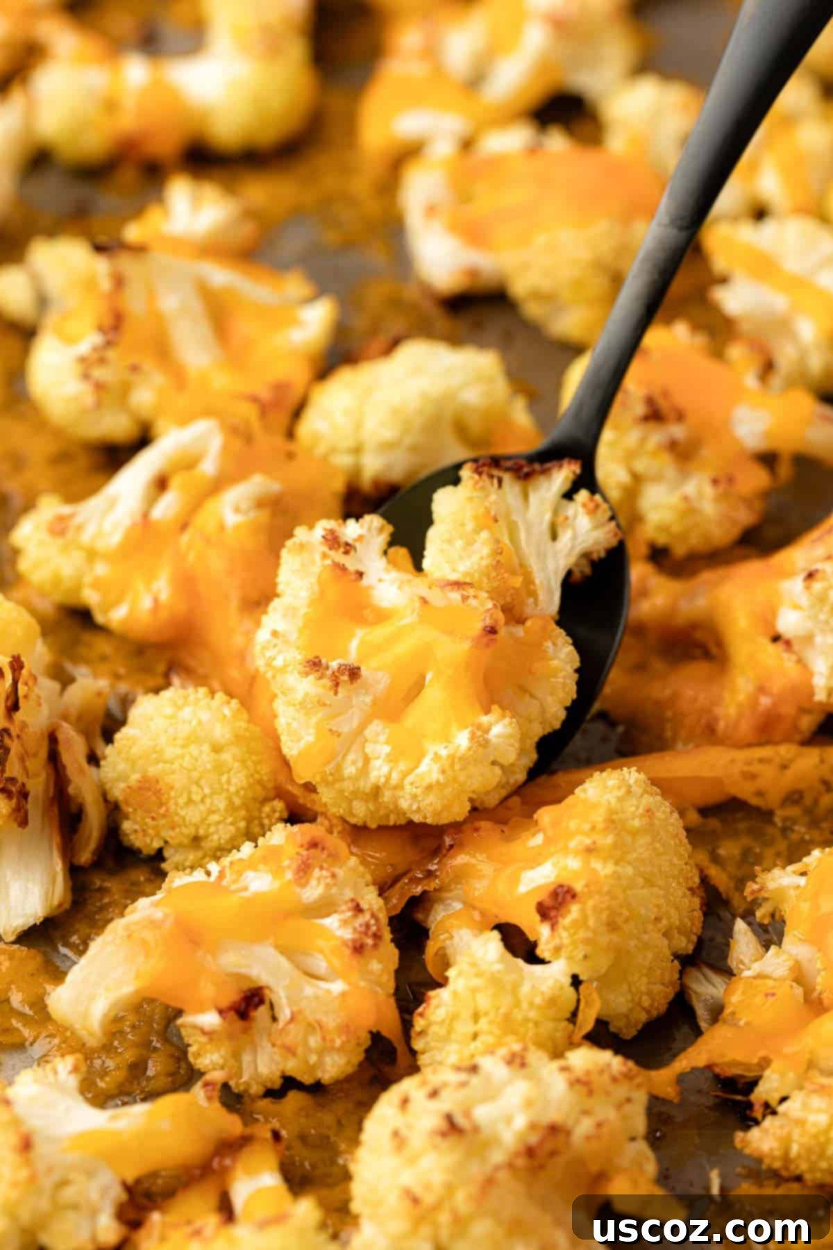 Golden Cheesy Roasted Cauliflower 18 roasted cheesy cauliflower on a baking sheet