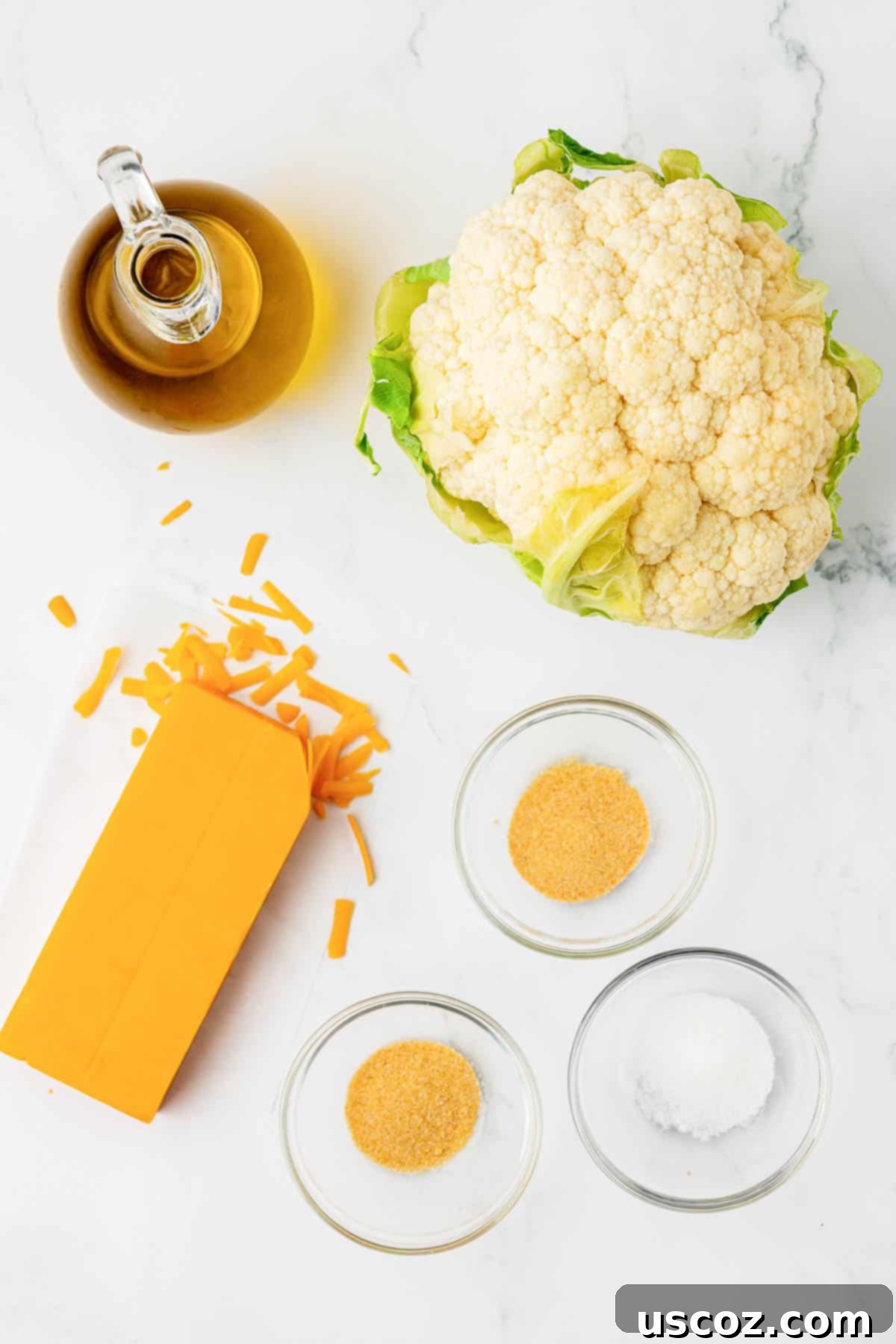Golden Cheesy Roasted Cauliflower 4 oil, cauliflower, spices, and cheddar cheese