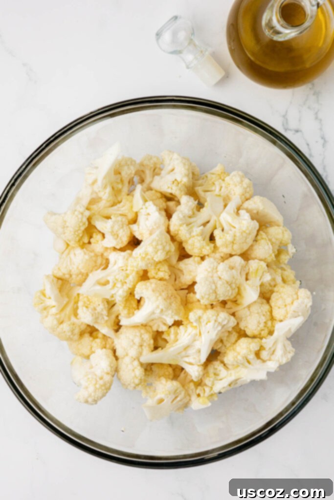 Golden Cheesy Roasted Cauliflower 9 cauliflower florets in a mixing bowl