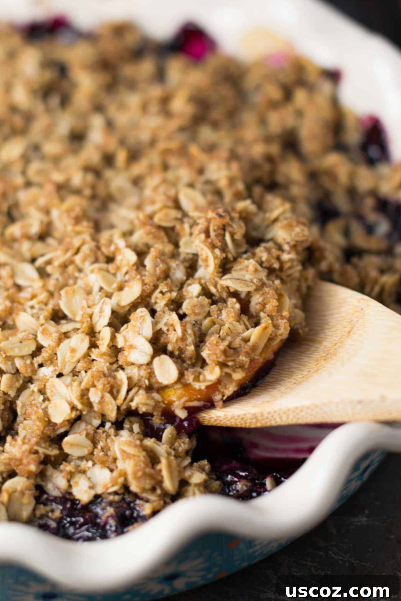 Vegan crisp recipe made with frozen fruit, peaches and blueberries